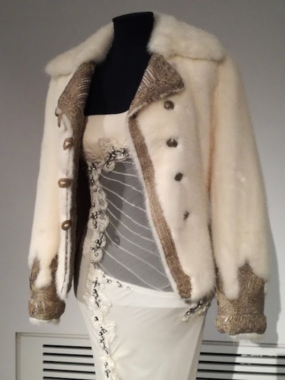 Detail of outfit with white ermine. Detail of outfit with white ermine.