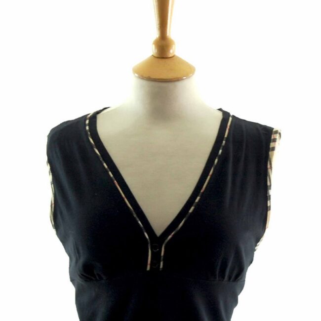 Close up of Ladies Black V Neck Burberry Top