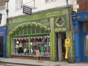 cheap retro clothing shop front with signage, original tiling & windows