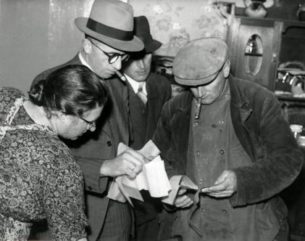 what are the best workwear jacket brands.One Woman and two Men , one wearing workwear jacket, Netherlands, 1941