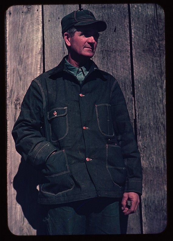 Man wearing bill cap and denim workwear jacket, circa 1941 Man wearing bill cap and denim workwear jacket, circa 1941