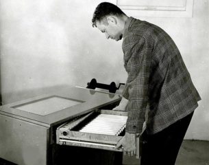 Vintage office wear-John Wear with office light table drawer open, 1958 Portland, Oregon.Photo by Wally C.Guy