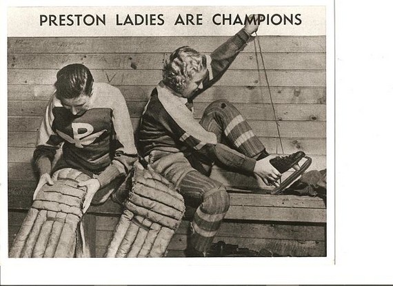 Two women putting on hockey equipment, 1940 Two women putting on hockey equipment, 1940