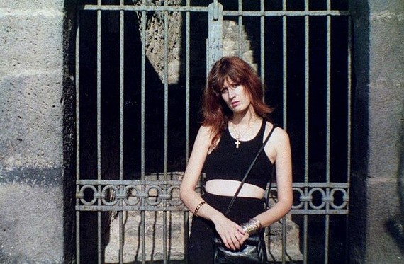 What work clothing always stays fashionable - Woman wearing black crop top and mini skirt, 1989 What work clothing always stays fashionable - Woman wearing black crop top and mini skirt, 1989