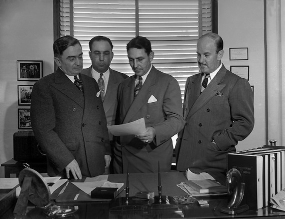 Officials in double breasted suits confer on the Zoot Suit Riots, 1943 Officials in double breasted suits confer on the Zoot Suit Riots, 1943