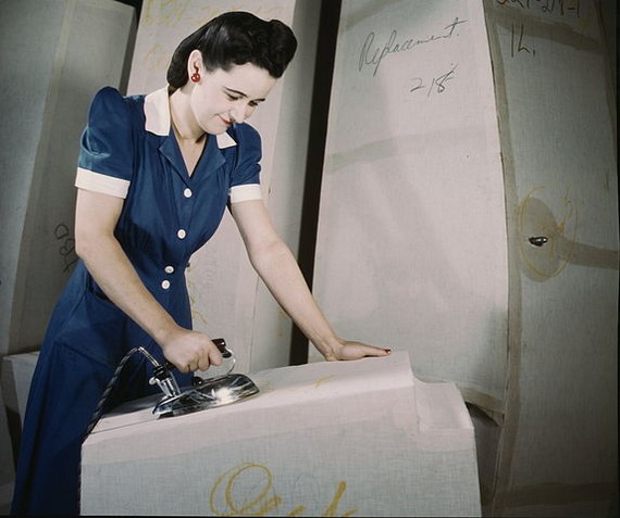 Woman wearing day dress, ironing, 1941 Woman wearing day dress, ironing, 1941