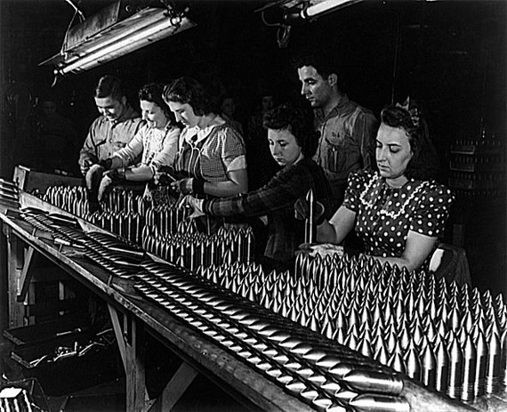 Women working along men in shell production for the war effort, Midwest. USA, 1948 Women working along men in shell production for the war effort, Midwest. USA, 1948