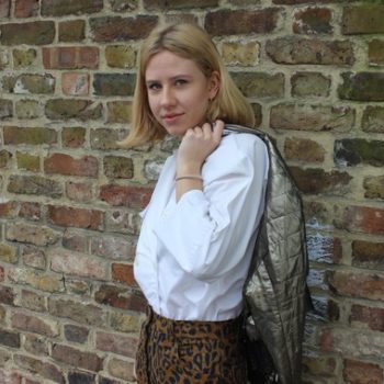 Alex models Leopard print trousers and white long sleeved blouse