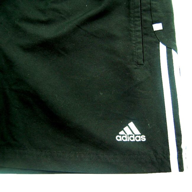 front of 90s Black Adidas Shorts