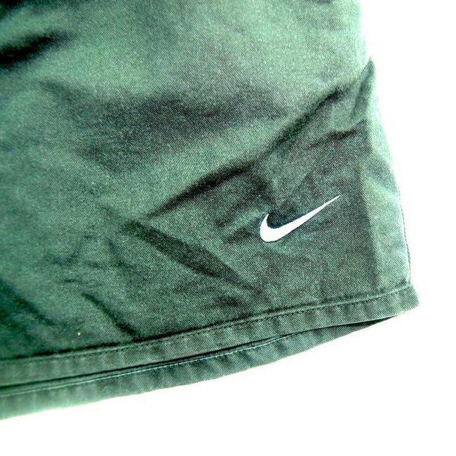 front of 90s Black Nike Shorts