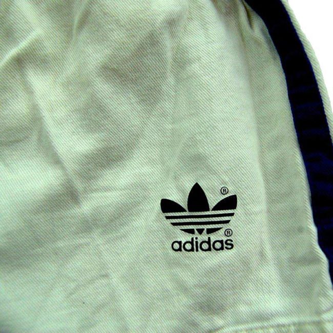 front of 90s Cream Adidas Shorts