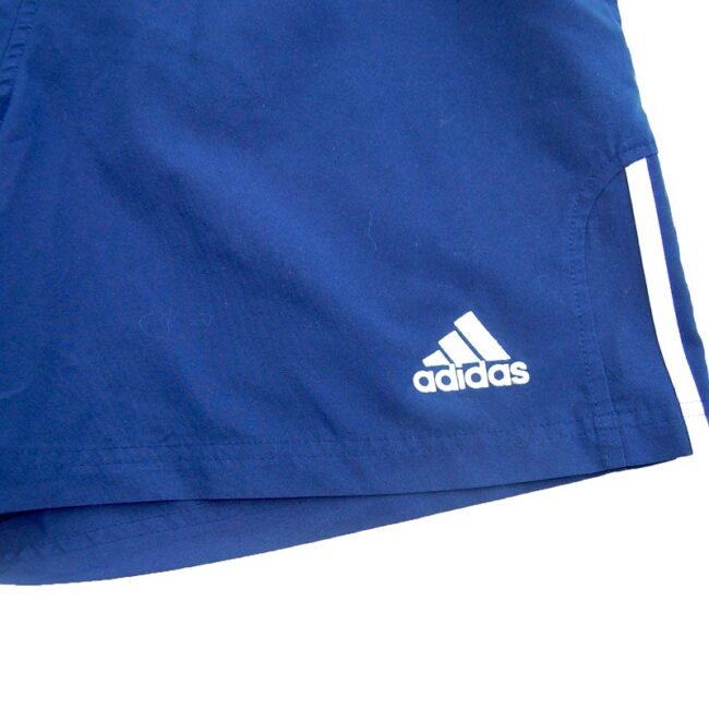 front of 90s Navy Adidas Shorts