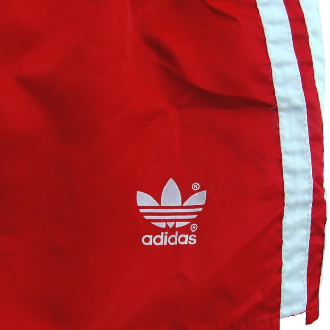 front of 90s Red Satin Adidas Shorts