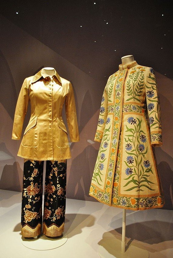 70s style clothing, Ossie Clark 'Lamborghini' trouser suit, 1969, and Bellville Sassoon coat, 1971 70s style clothing, Ossie Clark 'Lamborghini' trouser suit, 1969, and Bellville Sassoon coat, 1971