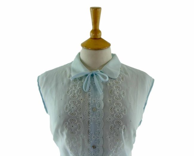 Close-up-of-60s-Pale-Blue-Embroidered-Sleeveless-Blouse