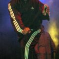Chuck D in Adidas shell suit top and Adidas shell suit bottoms