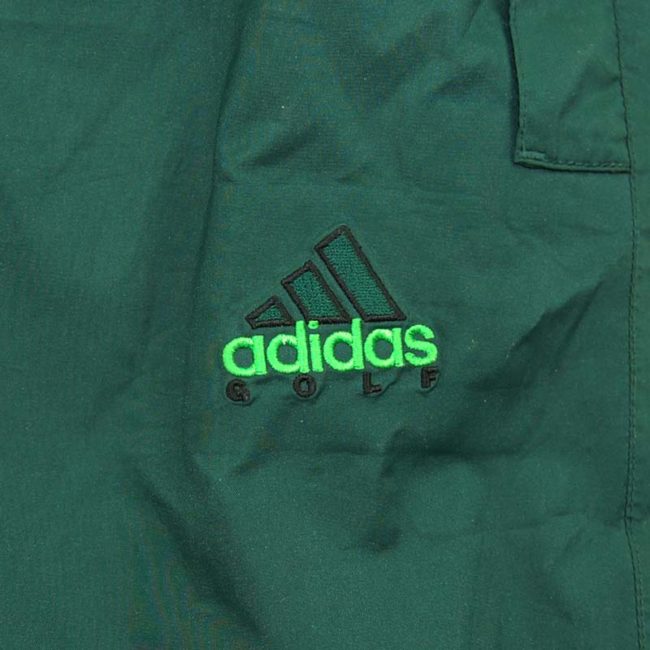 label of 90s Green Adidas Golfing Trackie Bottoms