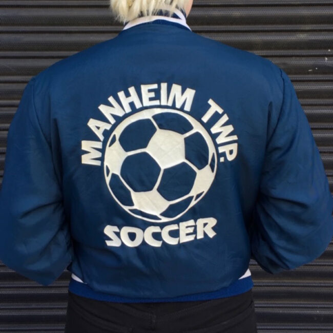 back of Soccer Club Baseball Jacket