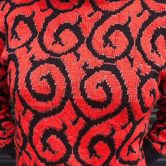 close up of 80s Red Glitter And Black Jumper