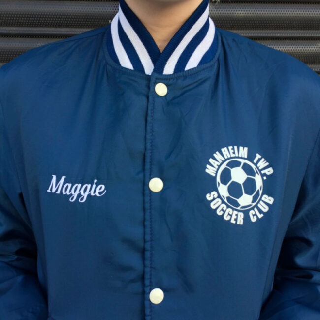 close up of Soccer Club Baseball Jacket