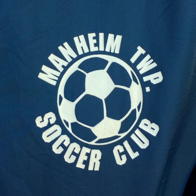 left side of Soccer Club Baseball Jacket