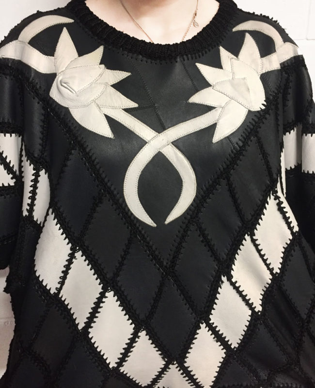 close up of Black And White Patchwork Jumper