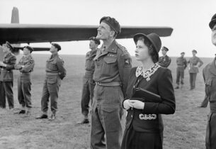 The Queen loves pockets too! HRH Princess Elizabeth watching parachutists dropping during a visit to airborne forces in England, 1944