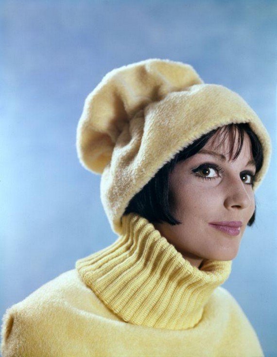 Studio photo of Sophie van Kleef, Dutch top model in the sixties, with a yellow fake fur hat. 1960 Studio photo of Sophie van Kleef, Dutch top model in the sixties, with a yellow fake fur hat. 1960