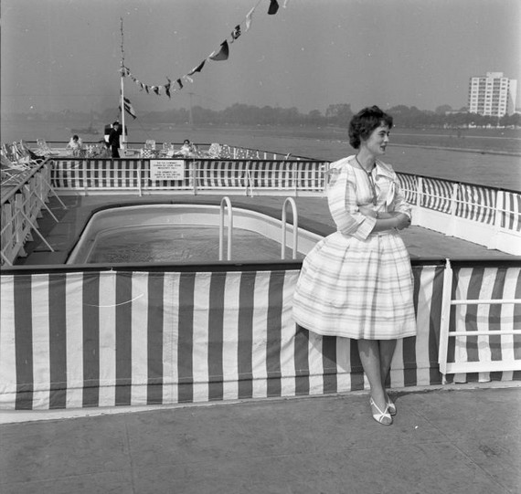 1960s Fashion - Woman wearing cotton print striped dress on board the cruise ship Europa, 1960 1960s Fashion - Woman wearing cotton print striped dress on board the cruise ship Europa, 1960