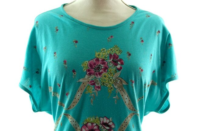 Close up of front Womans Turquoise Floral 80s Print T Shirt