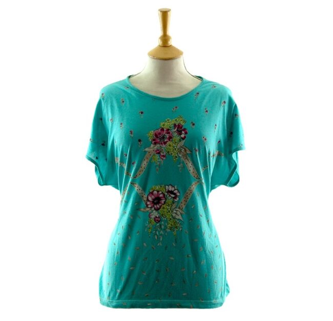 Front of Womans Turquoise Floral 80s Print T Shirt