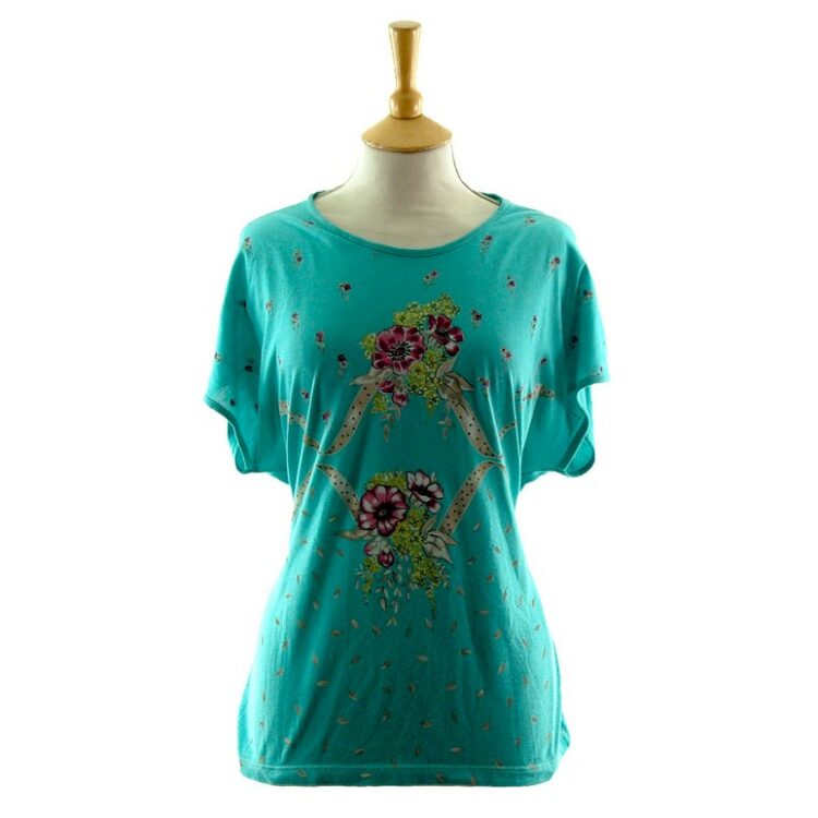 Front of Womans Turquoise Floral 80s Print T Shirt