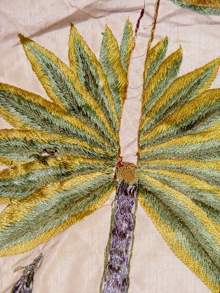 Machine embroidery - detail of a satin stitch palm tree Machine embroidery - detail of a satin stitch palm tree