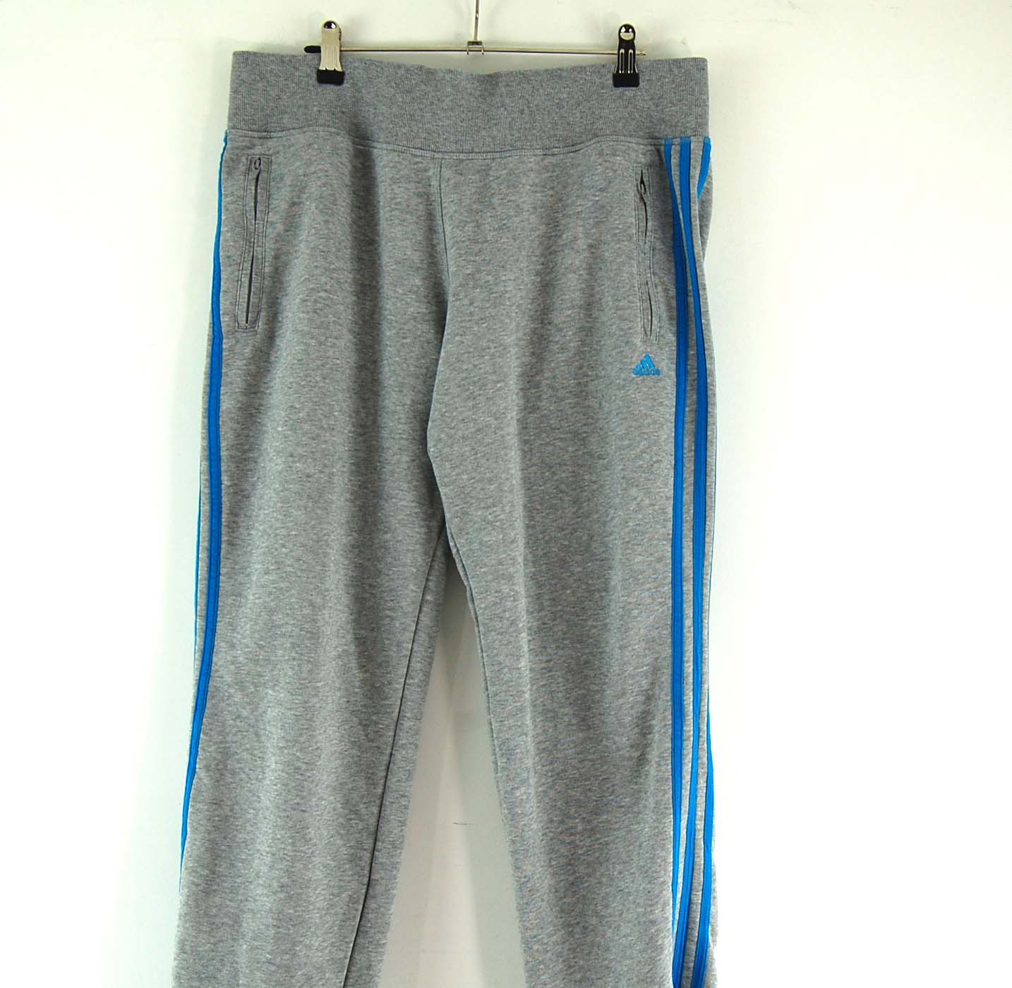 grey and blue adidas tracksuit