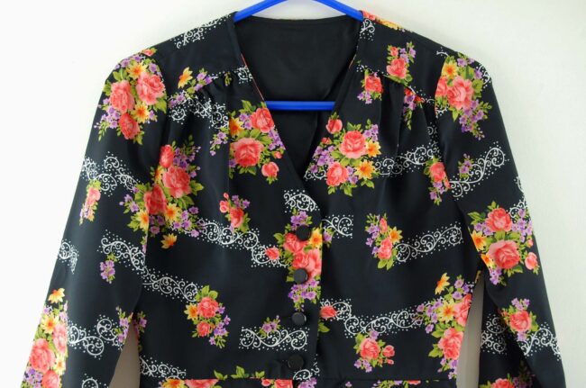 Close up of Black Floral Peplum Blouse