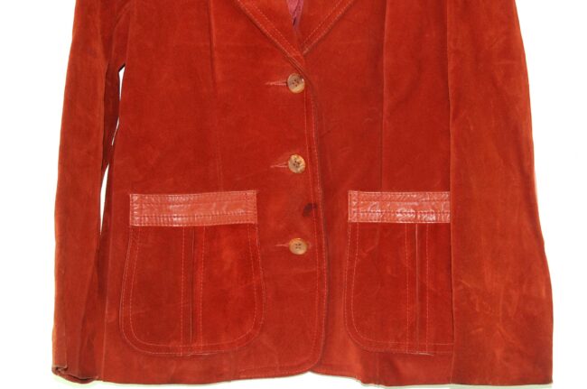 Close up of Rust Coloured Womans 70s suede jacket With Leather Trim