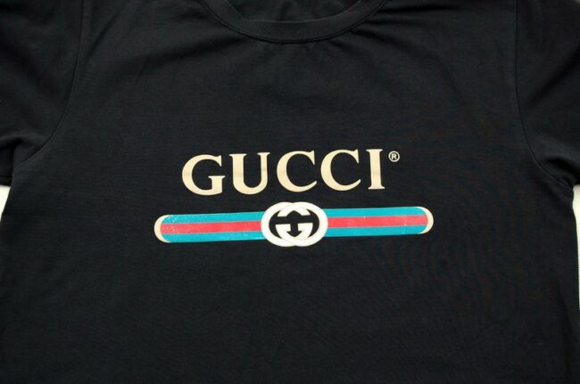 Close up of Black Gucci Logo T Shirt
