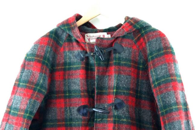 Close up of Womans Tartan Duffel Coat