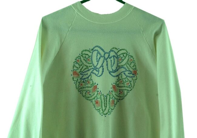 Close up of White Heart Crew Neck Sweatshirt