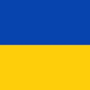 Traditional Ukrainian clothing. Ukrainian Flag. Image via Wikimedia.