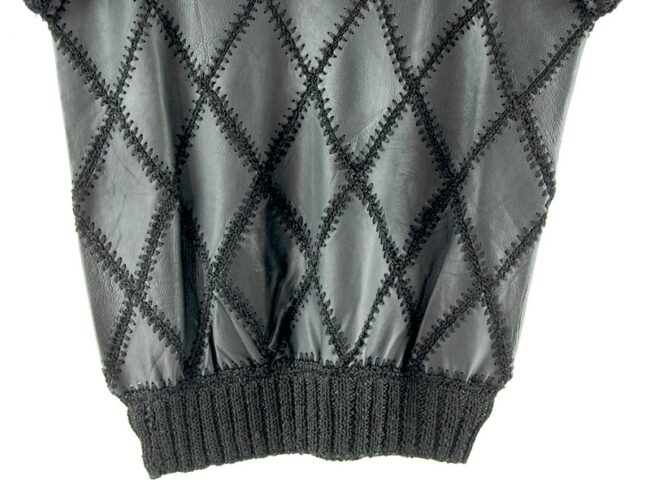 Close up of bottom of 80s Black And White Patchwork Jumper